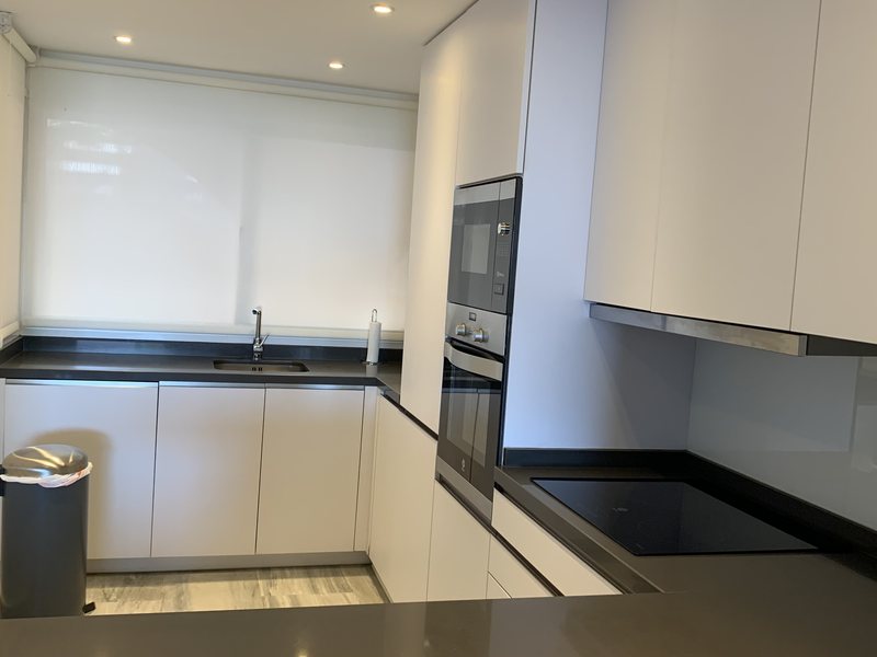 Modern white kitchen cleaning in Nueva Andalucia
